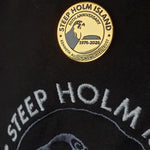 Gold badge with 'Steep Holm Island' text on a black background