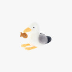Plush toy resembling a seagull with a fish on a white background