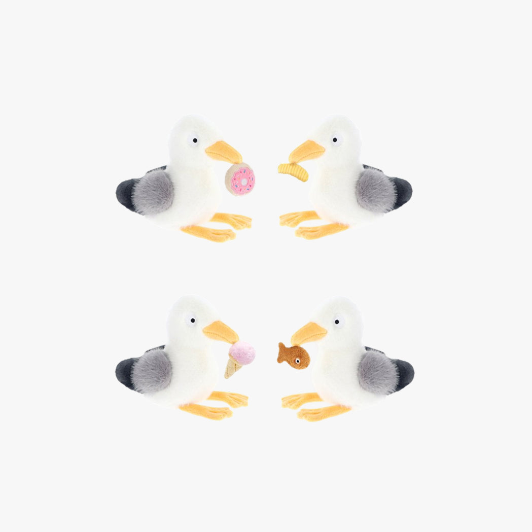 Four plush seagull toys with colorful accents on a white background