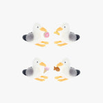 Four plush seagull toys with colorful accents on a white background