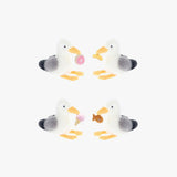 Four plush seagull toys with colorful accents on a white background